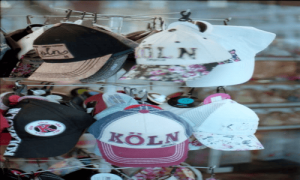 Close‑up of multiple Köln caps showcasing different hat styles.