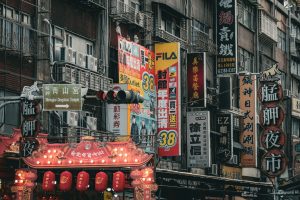 Marketing banners and neon signs in a crowded Taipei street to increase brand visibility