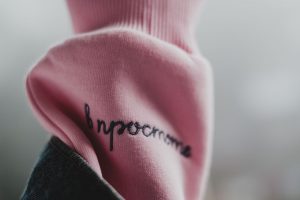 Embroidered script on a pink sleeve following embroidery placement guidelines