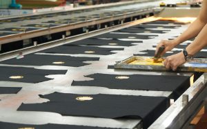 Screen printing t-shirts on a line, turning event attendees into brand ambassadors